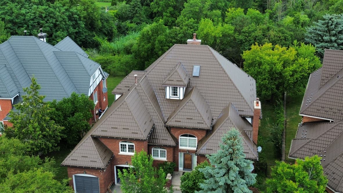 Metal tile roofing — aerial view of completed residential installation